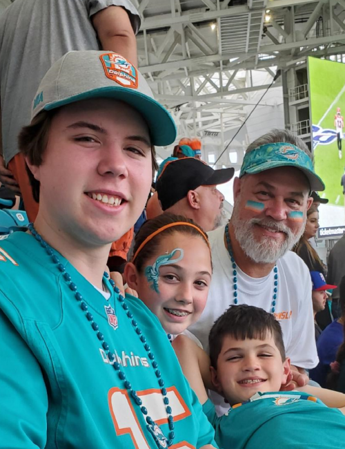 Photo of Woody Estep's family at Miami Dolphins football game.