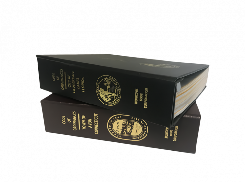 Photo of sample municipal code books produced by Municode.